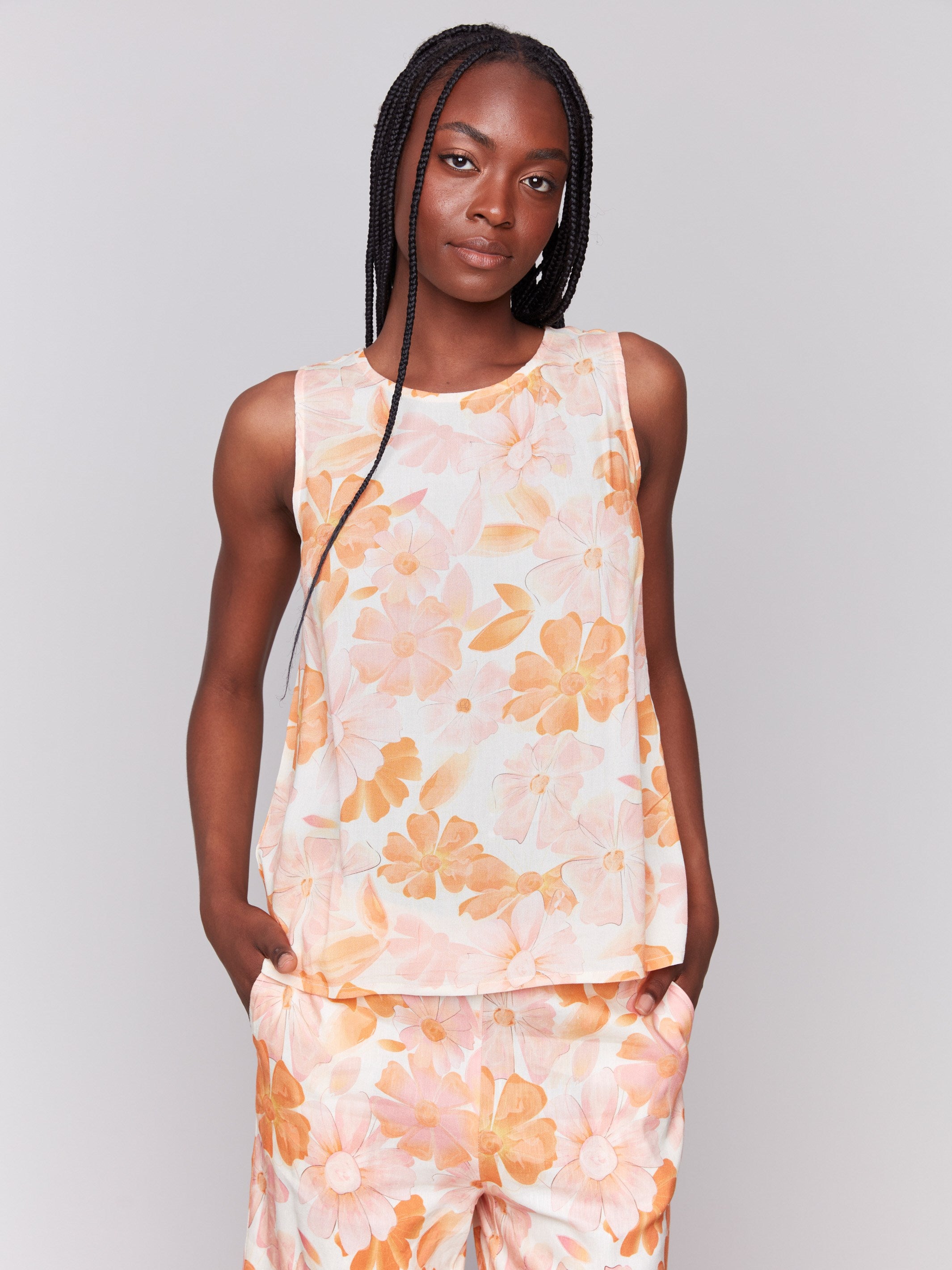 Stylish top showcasing a delicate keyhole back detail and blooming floral patterns by Charlie B.