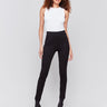 Black slim-leg pants with a regular rise, featuring a slit detail and an elastic waistband by Charlie B.