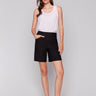 Black shorts with a mid-rise waist and stretch fabric by Charlie B.