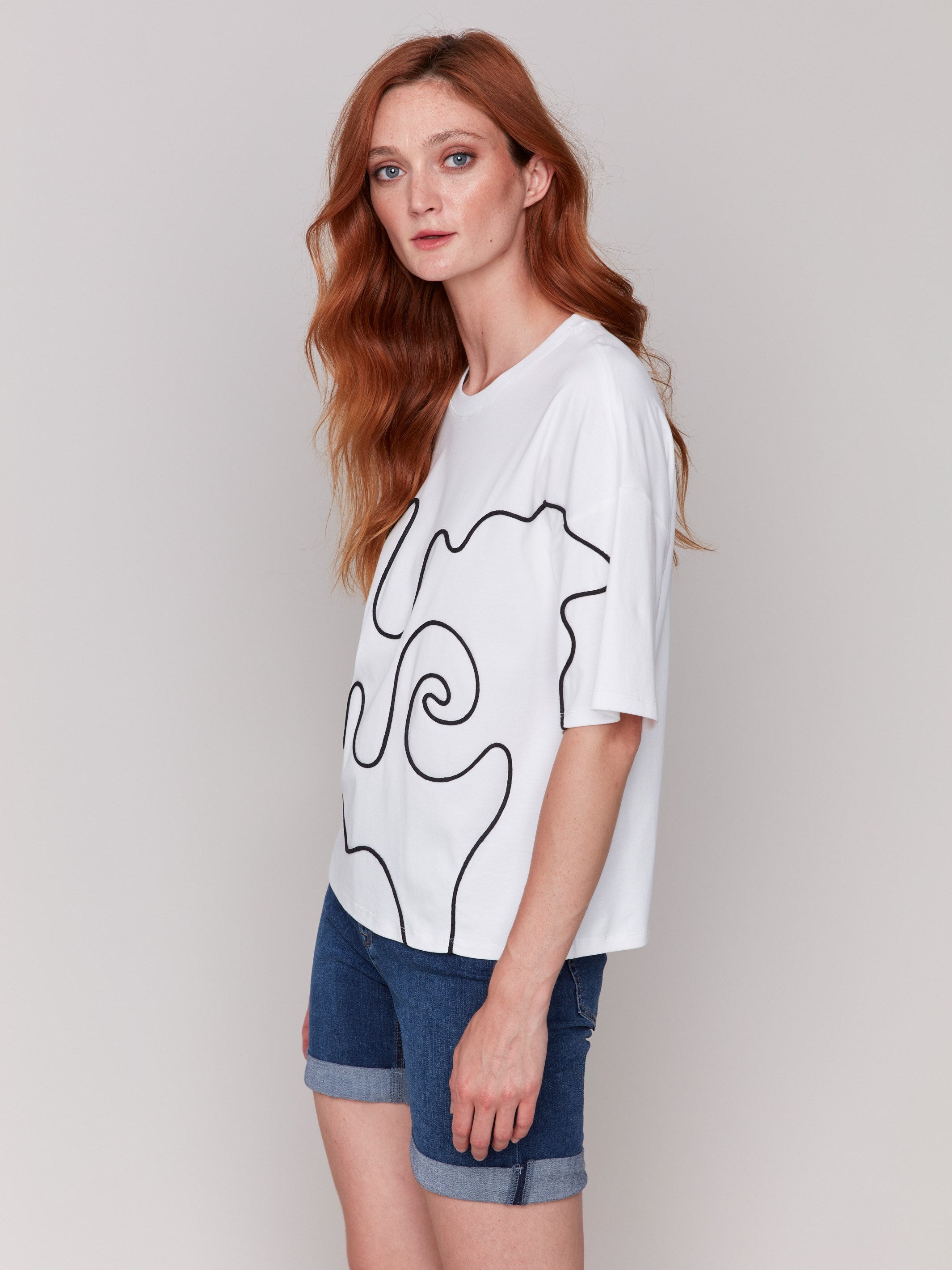 Short sleeve white t-shirt with intricate front soutache accents by Charlie B.