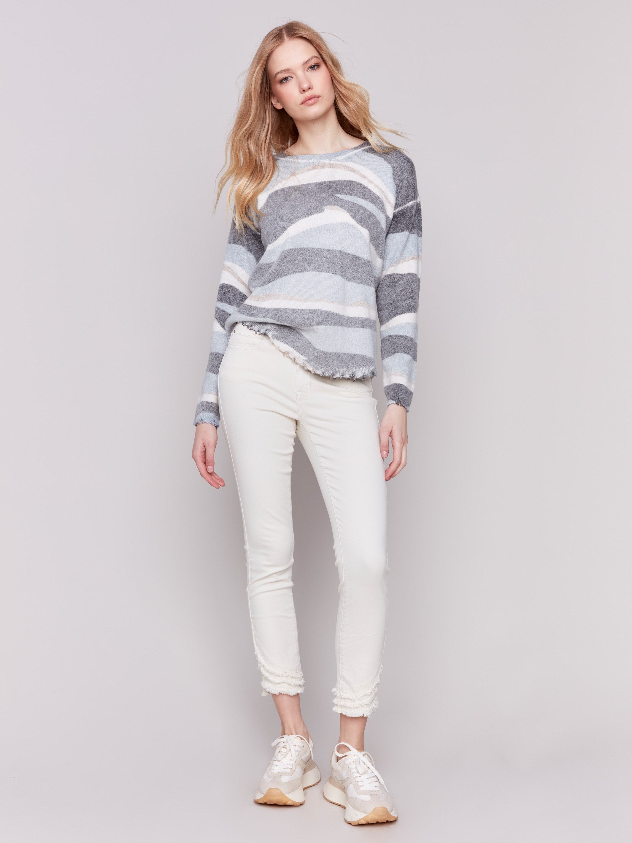 Reversible denim printed plush sweater with frayed edges and boatneck by Charlie B.