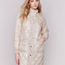 Champagne and white quilted puffer jacket reversible to white with a high collar and patch pockets by Charlie B.