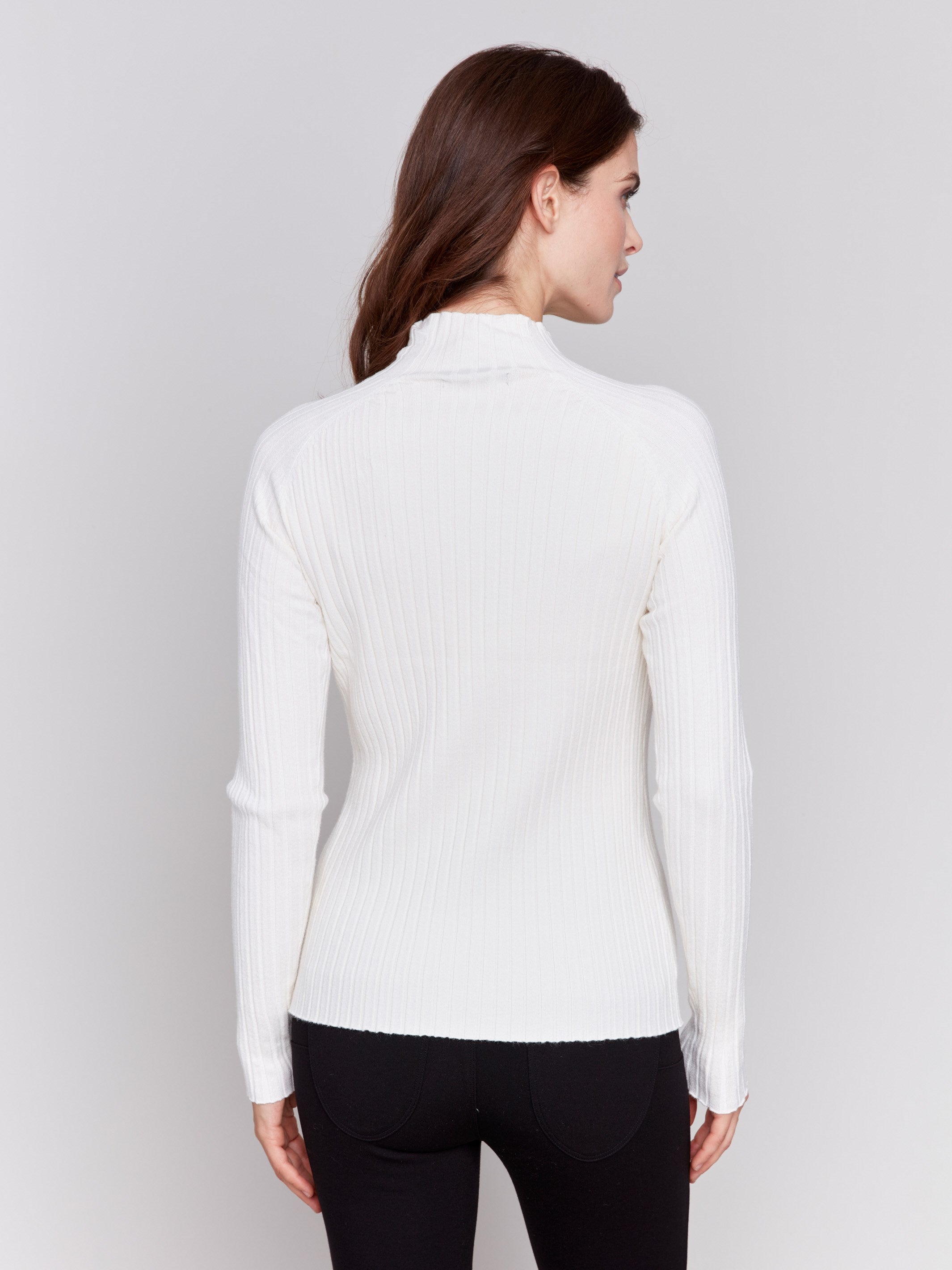 Ecru ribbed knit sweater with a mock neck and long sleeves by Charlie B.