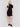 Black short-sleeve mock neck sweater dress with side slits by Charlie B.