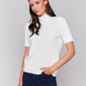 Ecru short sleeve mock neck sweater with ribbed cuffs and hem by Charlie B.