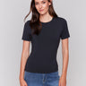 Black short-sleeved super stretch top with a crew neckline, showcasing a slim fit design by Charlie B.