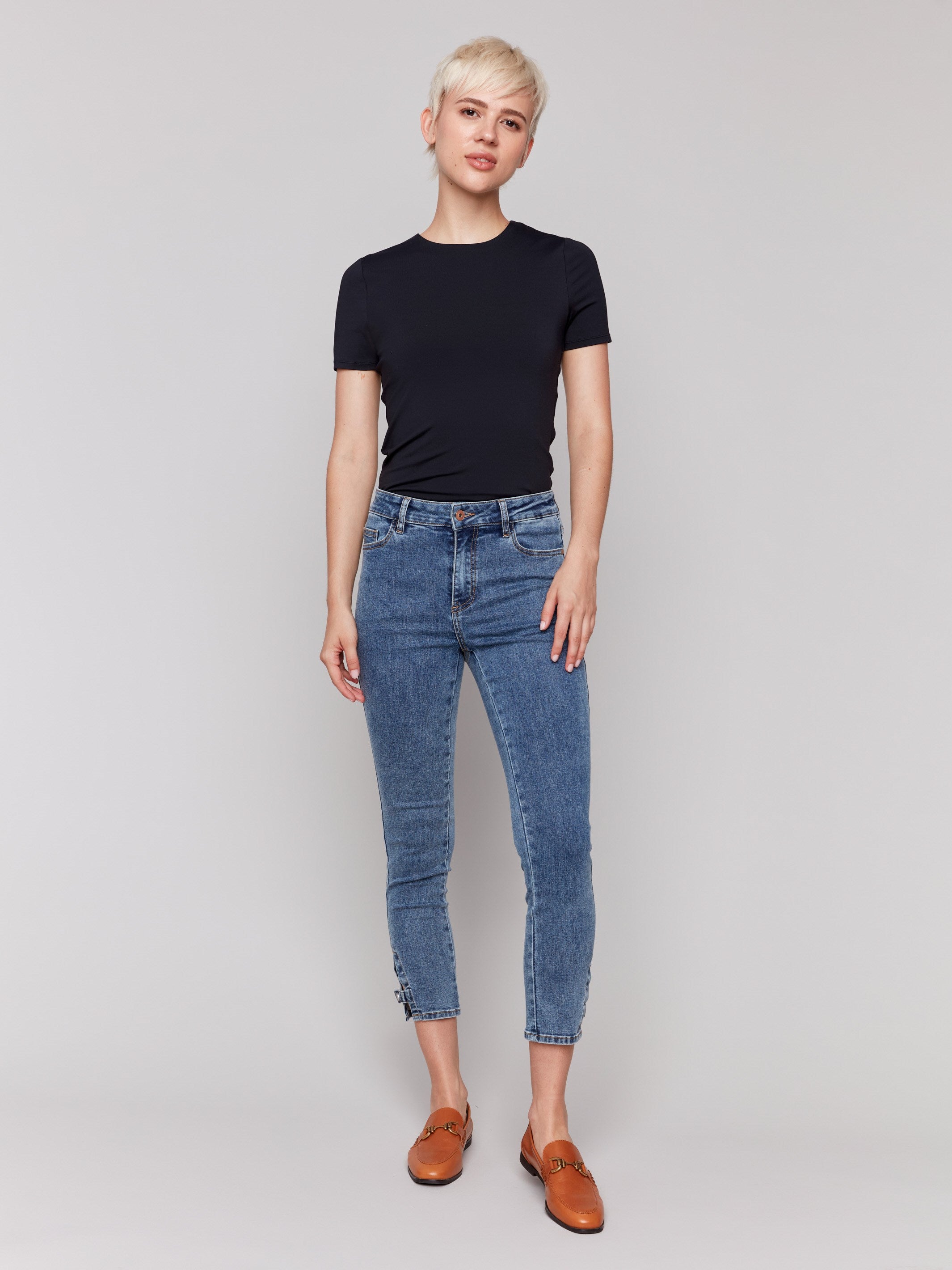 Medium blue jeans with stretch denim material, perfect for comfort and style by Charlie B.