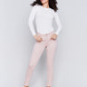 Slim fit twill pants in quartz pink with frayed tulip hem, featuring five-pocket design by Charlie B.