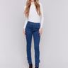 Indigo jeans with slim leg featuring side rose embroidery and side slits by Charlie B.