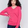 Magenta pink V-neck sweater with long sleeves featuring side slits, made from plushy yarn by Charlie B.