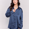 Navy blue solid satin button-down shirt with long sleeves, shirt collar, and a smooth finish by Charlie B.