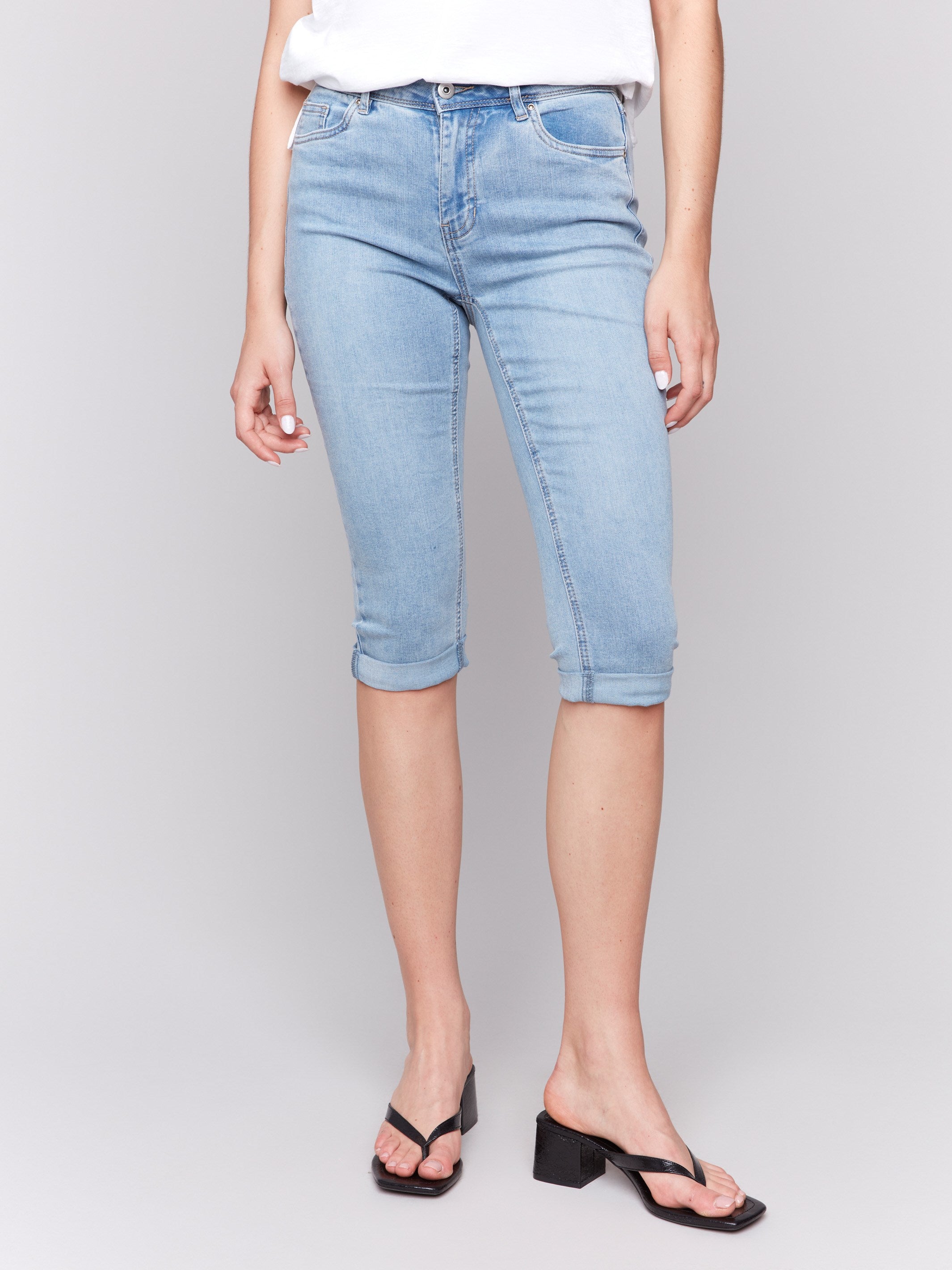 Denim pedal pusher pants featuring a comfortable mid-rise waist by Charlie B.