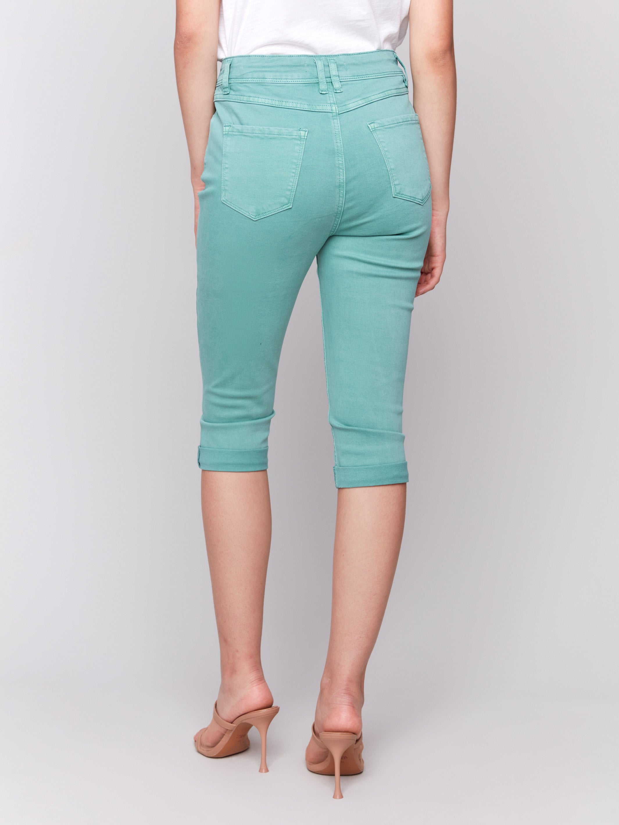 Green pedal pusher pants crafted from stretch twill fabric for comfort by Charlie B.