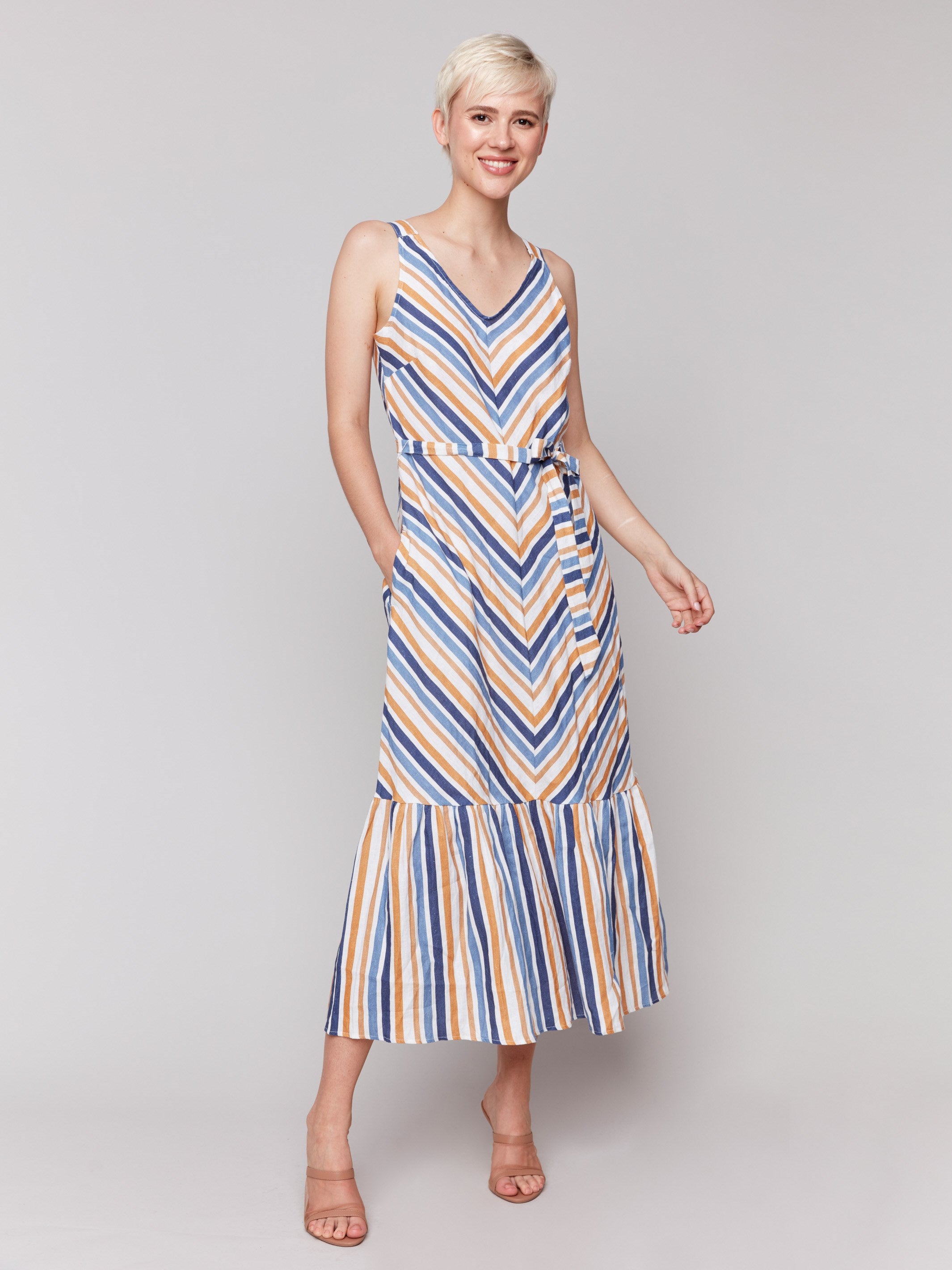 Ankle length striped dress with a sash and tiered hem by Charlie B.