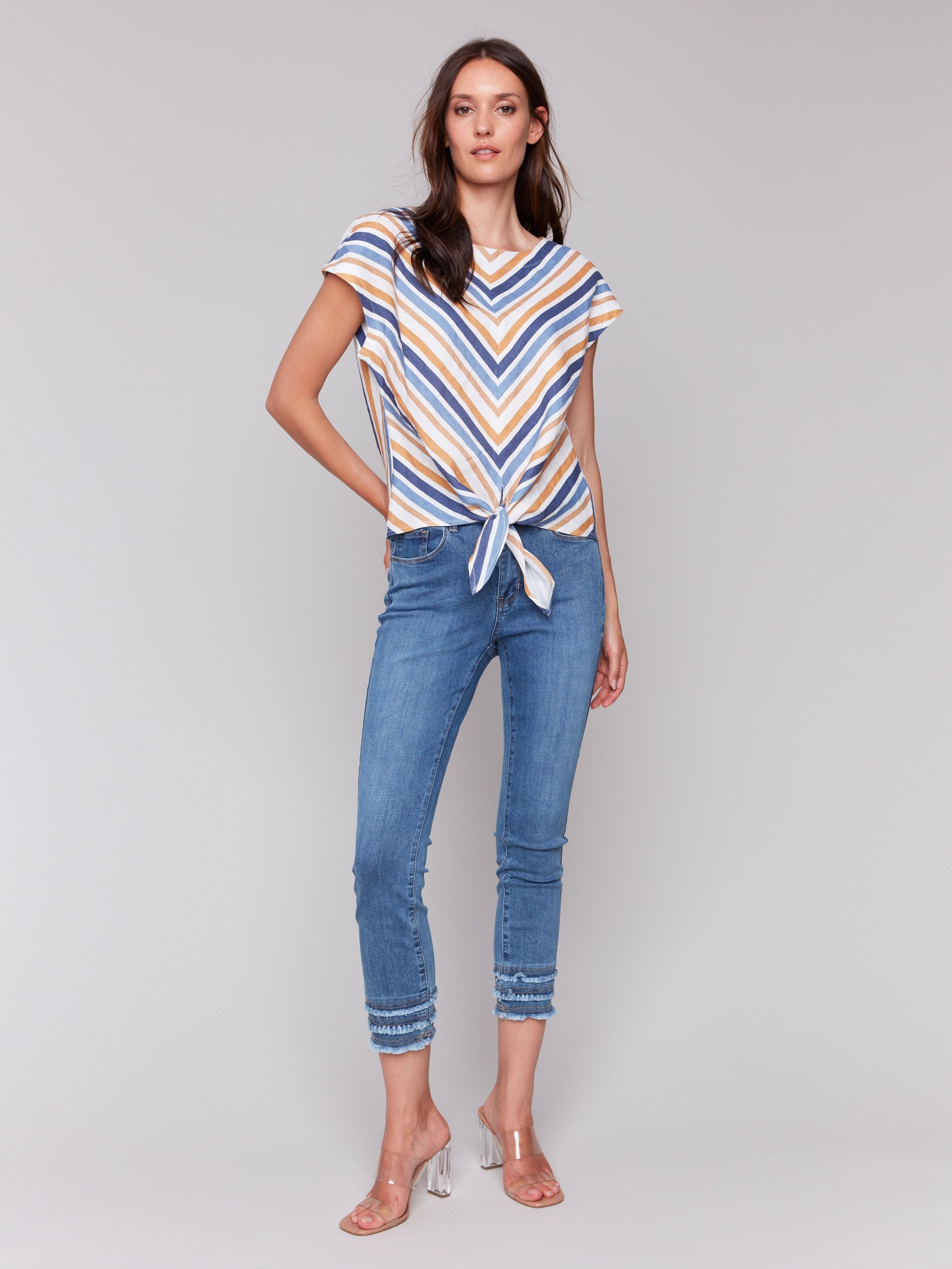 Blouse featuring a tie-front detail in denim stripes by Charlie B.