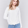 Ecru white long-sleeve sweater with front knot detail and V-neckline by Charlie B.