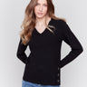 Black-colored V-neck sweater with long sleeves featuring grommet details at the side placket by Charlie B.