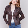 Mocha-colored faux leather biker jacket with zipper details and fake pockets by Charlie B.