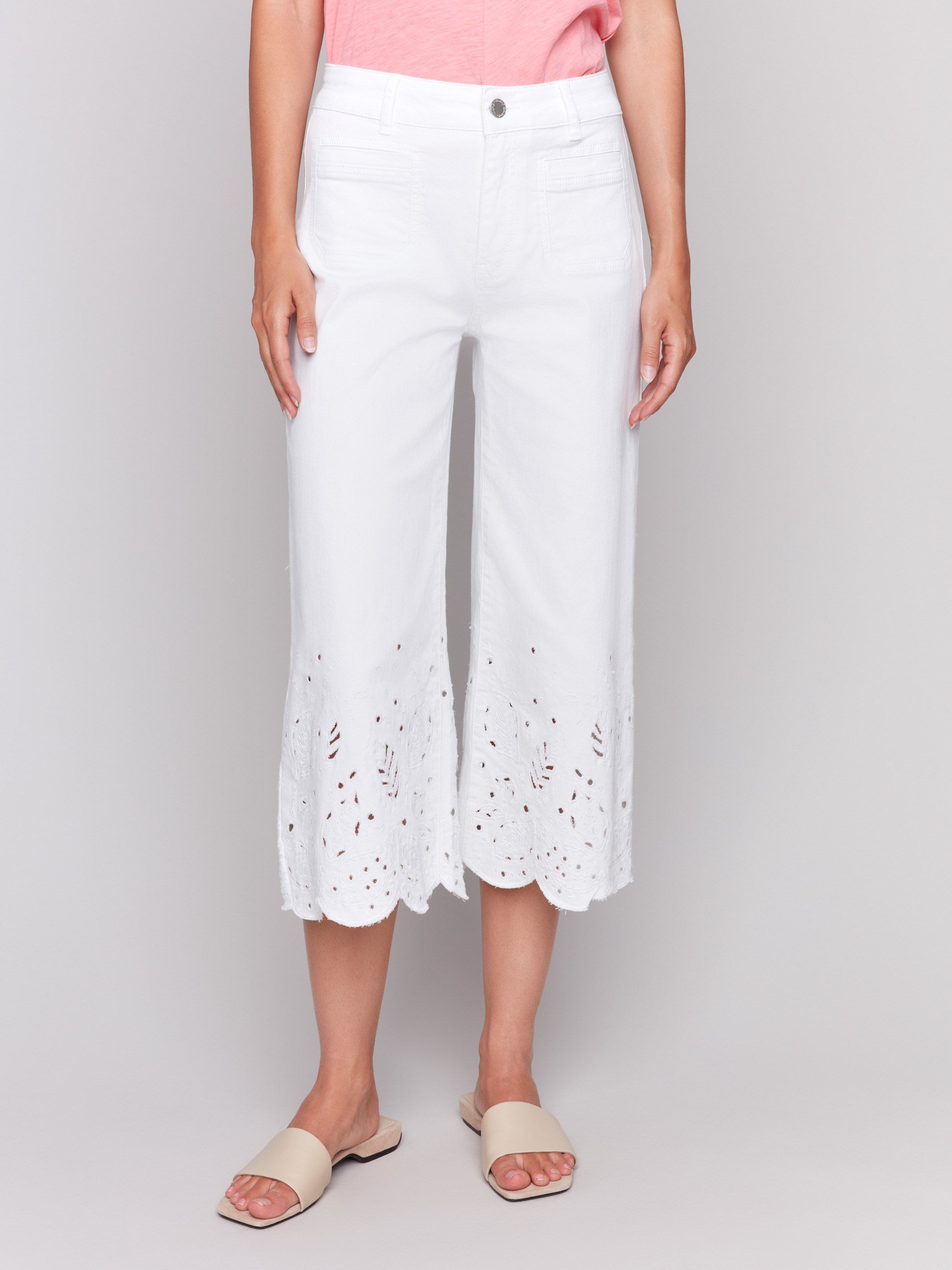 Cropped white jeans crafted from stretch twill material by Charlie B.