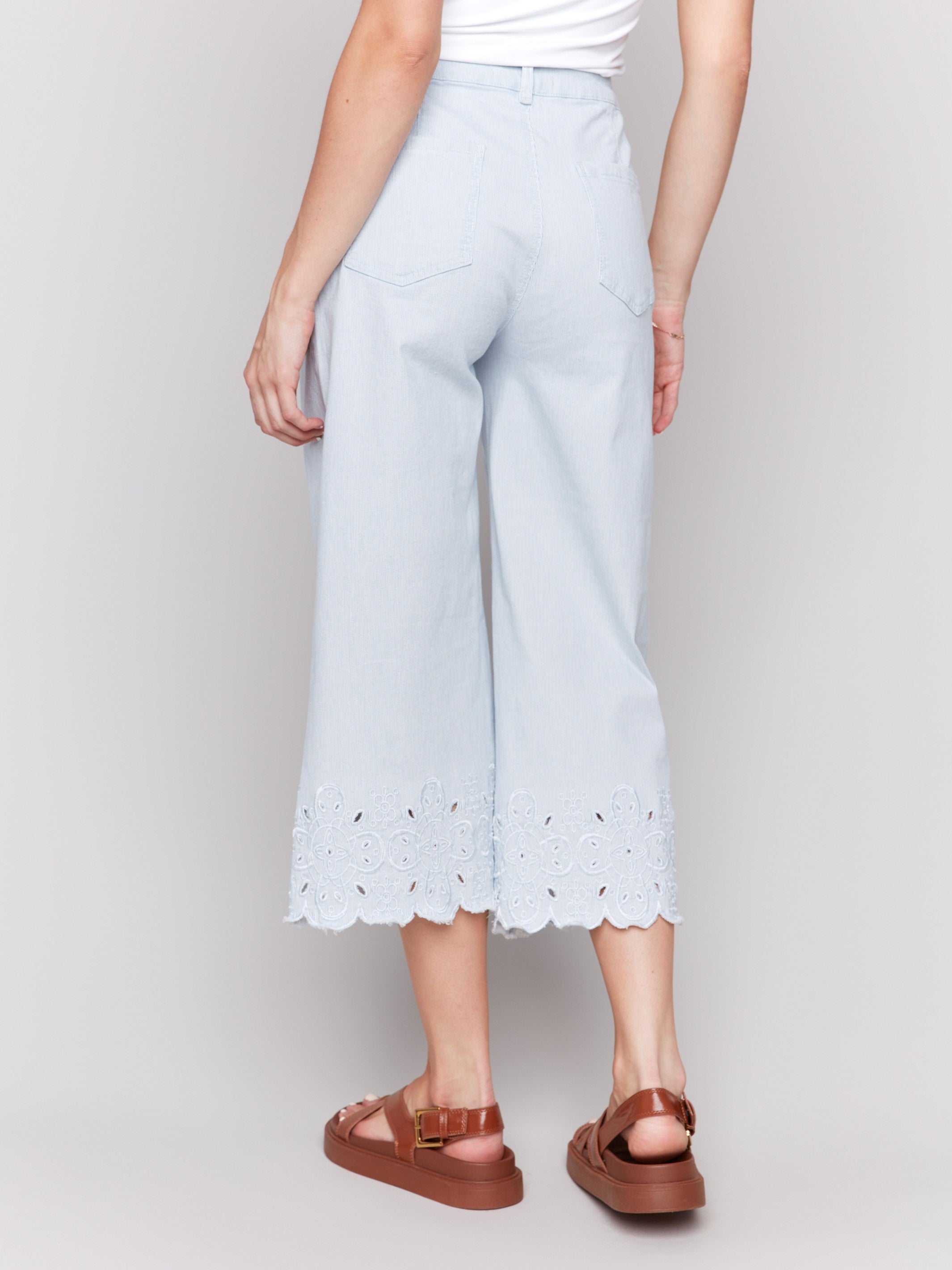 Wide-leg denim with stretch material and unique hem design by Charlie B.