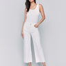 White wide-leg twill pants with raw edge hem, five-pocket design, and regular rise by Charlie B.